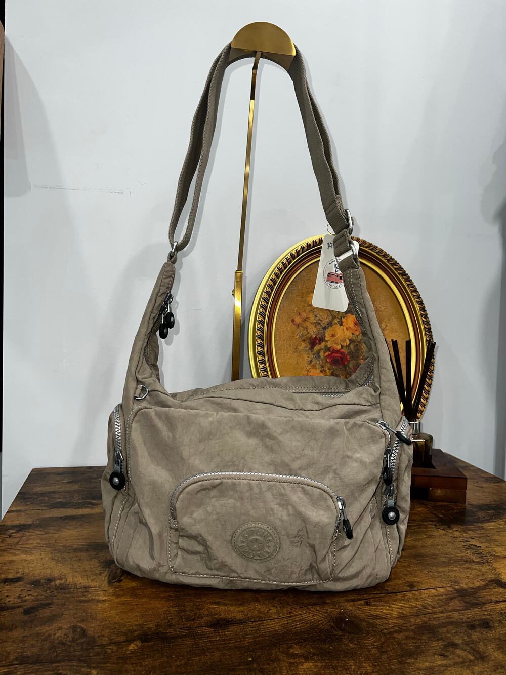 Kipling Beige Nylon Shoulder Bag with Multiple Zip Pockets and Adjustable Strap